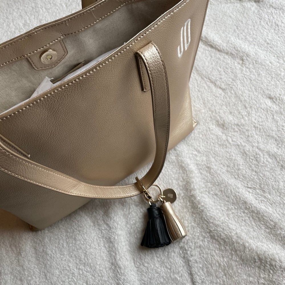 Mark and graham gold purse.